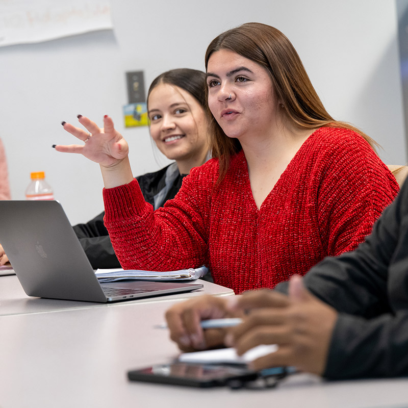 SJC Students having a discussion during a lecture