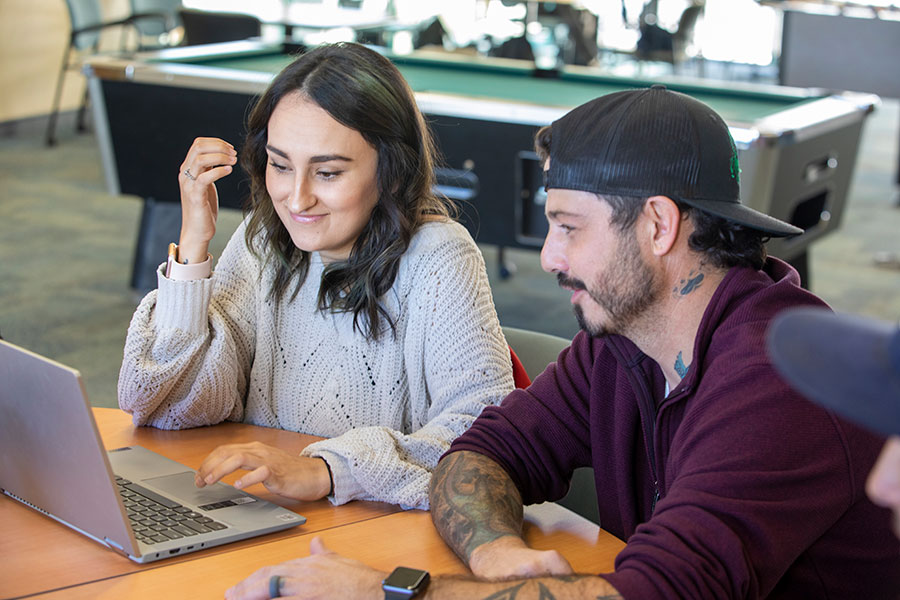 San Juan College students researching on their computer about the transfer process into four-year colleges.