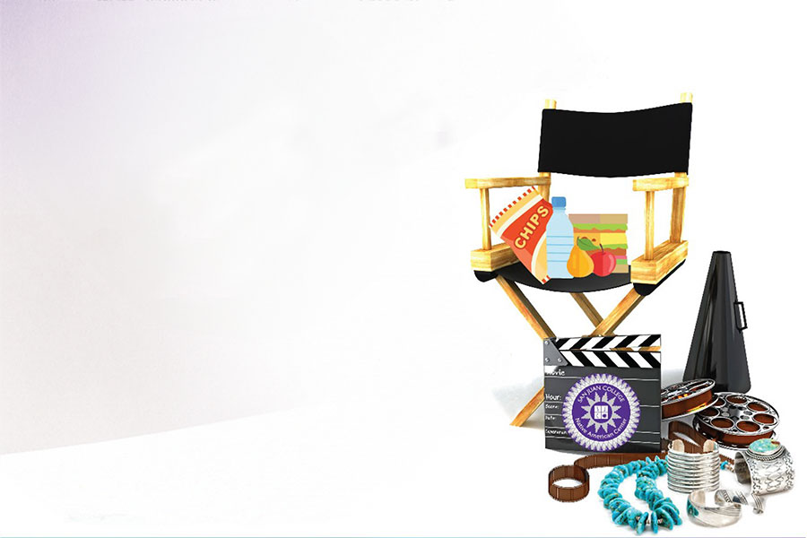 Native American Heritage Month Film Agenda a movie chair with a sandwich, water and fruit on the seat. A movie reel, and traditional tribal turquoise jewelry.