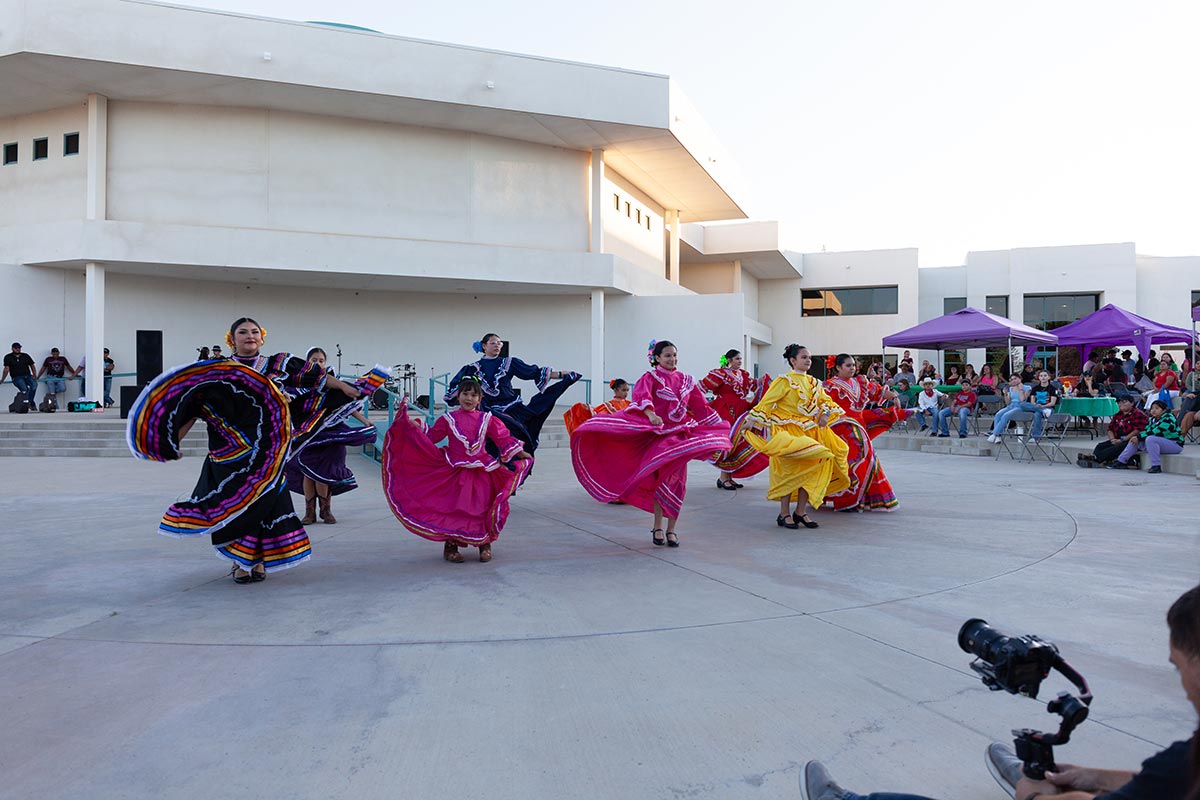 San Juan College hispanic students in traditional dress dancing at the Fiesta at Sunset event held by the Herencia Latina Center at San Juan College.